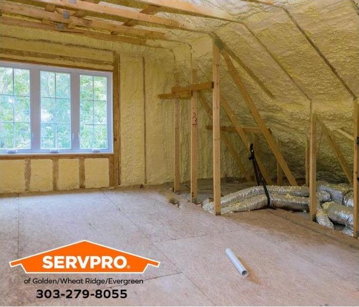 Insulation is added to an attic.